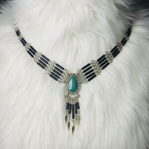 Elegant Silver and Black Necklace with Turquoise Accent